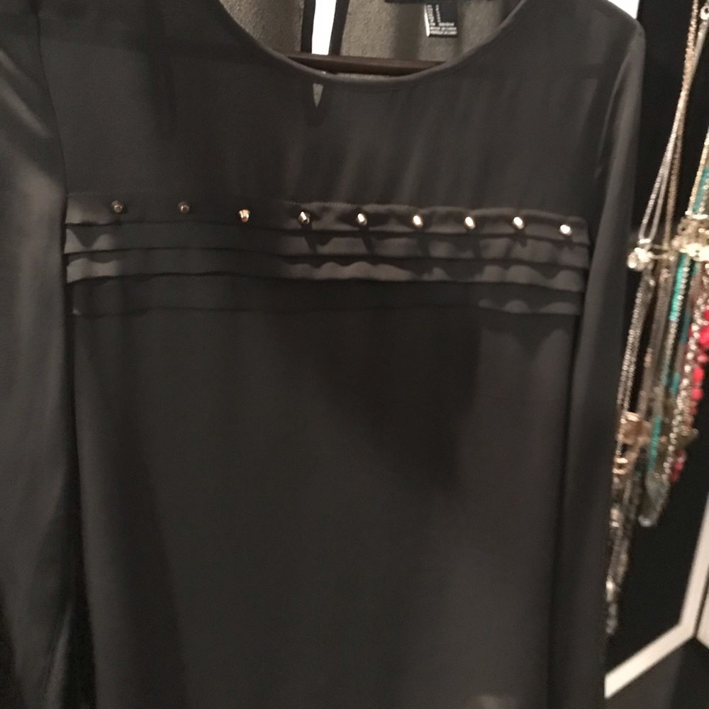 Women’s Black long sleeve blouse.